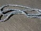 Preview: Briolette Perlen, Farbe: blau irisierend, Grösse: ±2x3mm, Menge: 50 Stk.