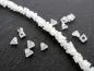 Preview: Triangular Facet-Polished glassbeads, Color: white alabaster, Size: ±2x4mm, Qty: ±50 pc.