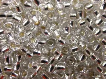 Rocailles, Farbe: kristall mit silber einzug, Grösse: ±2mm, Menge: 1 Sack ±17 gram