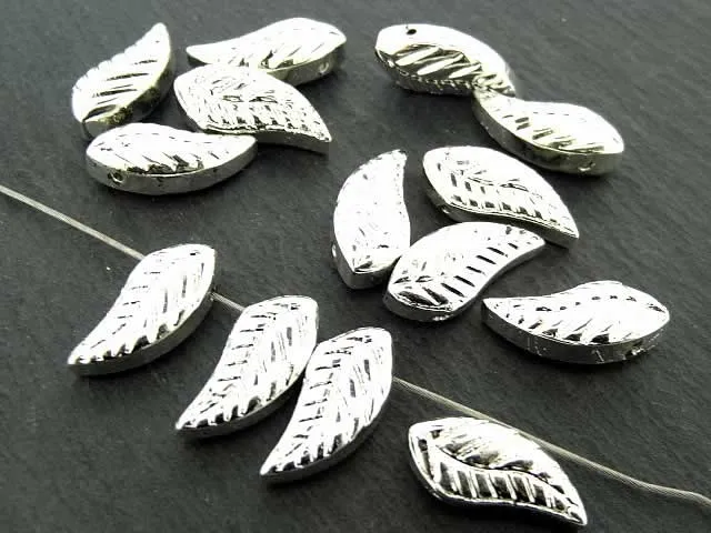 Wing made of glas, Color; silver, Size: ±18x8mm, Qty: 2 pc.